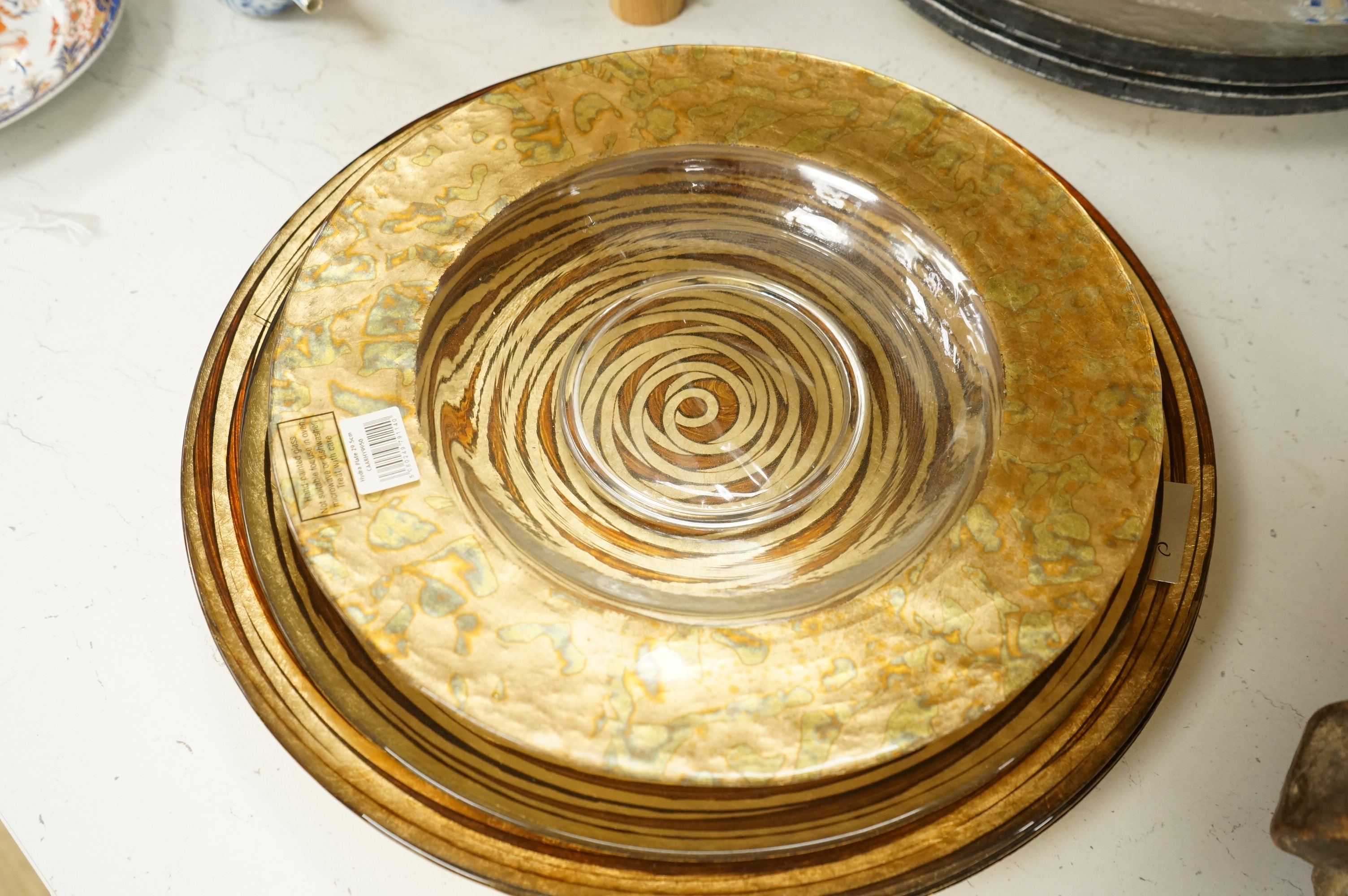 Deborah Timperley, a Studio art glass dish, 34cm, together with ten Carnelian studio glass dishes, largest 37cm